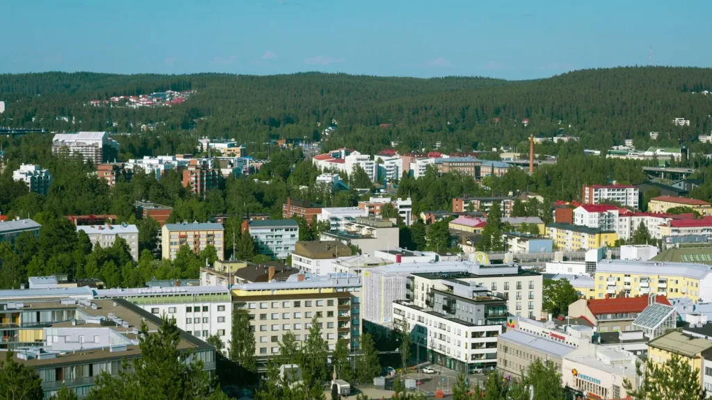 white-concrete-building-near-green-trees-during-daytime