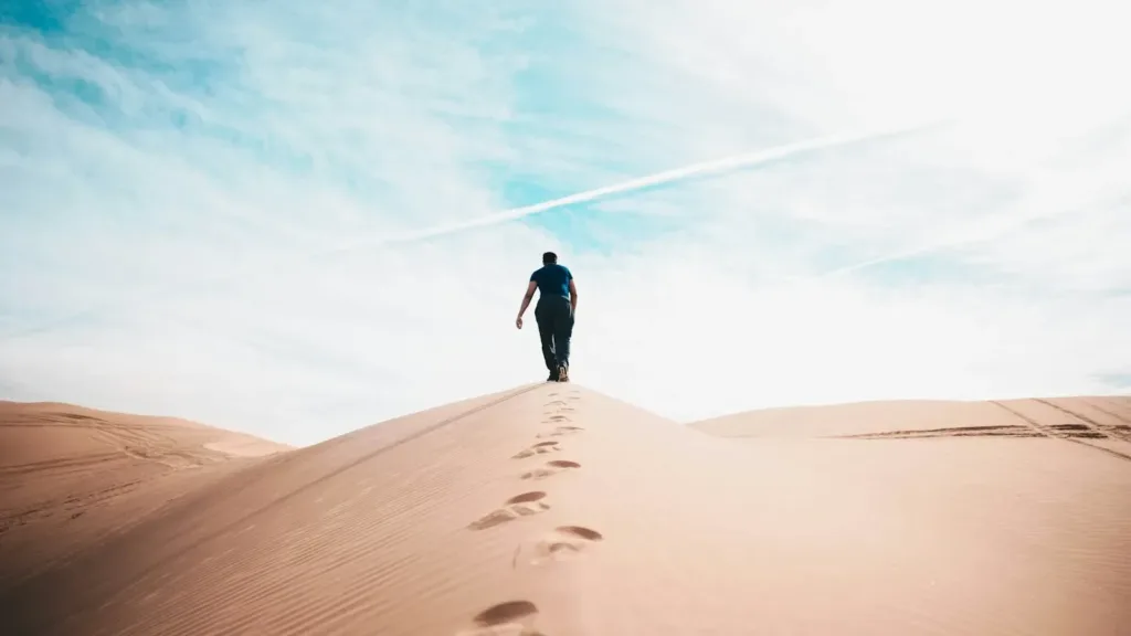 man-walking-on-desert