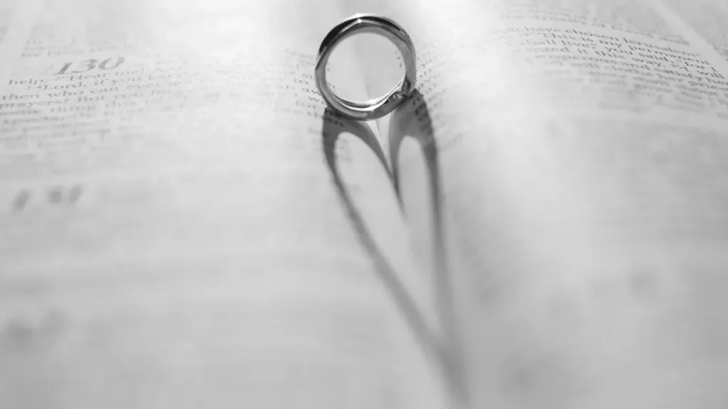 A-ring-casts-a-heart-shaped-shadow-on-a-book